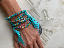 Load image into Gallery viewer, Hand wearing 2 Lock Wraps shown in this photo. 
