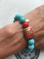 Tibetan Om + Red Coral