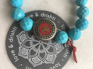 Tibetan Om with red leather