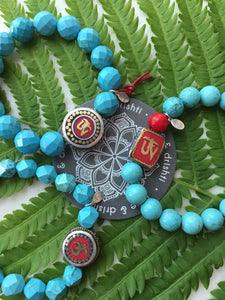 Tibetan Om with red leather